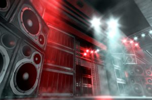 close up of sound system on a concert stage with large speakers and subwoofers